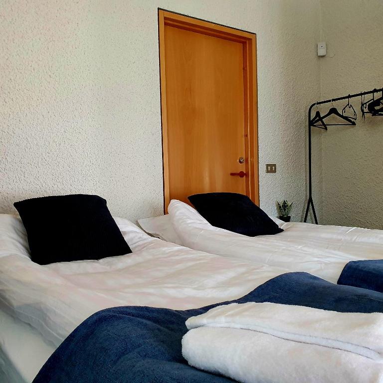 Postel nebo postele na pokoji v ubytování The Bank Sleeping Guesthouse