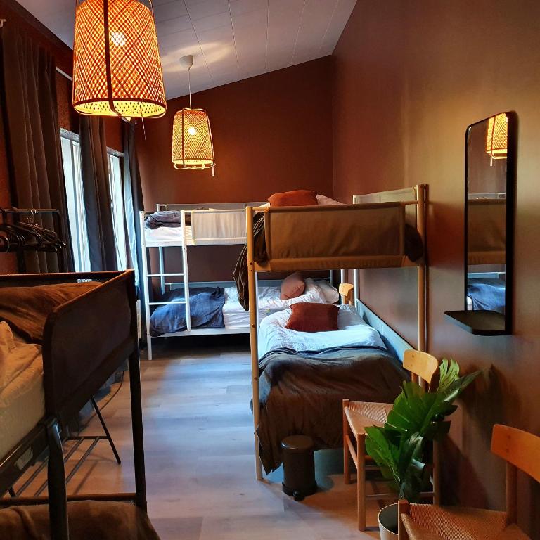 Postel nebo postele na pokoji v ubytování The Bank Sleeping Guesthouse