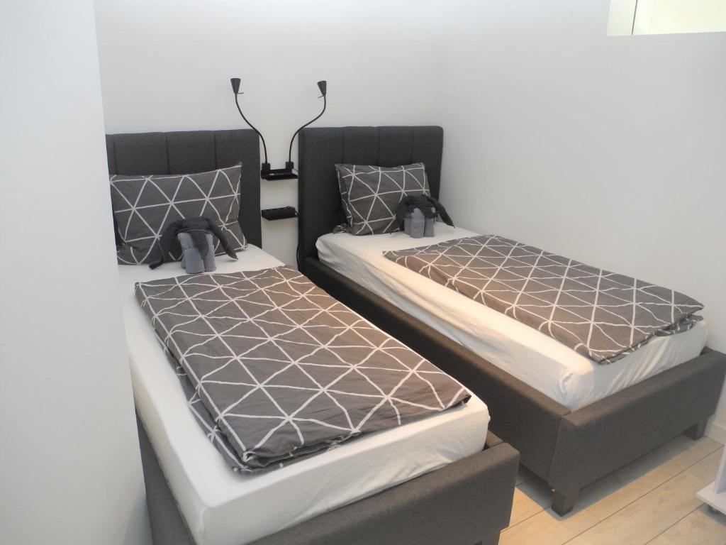 Postel nebo postele na pokoji v ubytování Strandappartement Steinberghaff "Farborg" mit Meerblick
