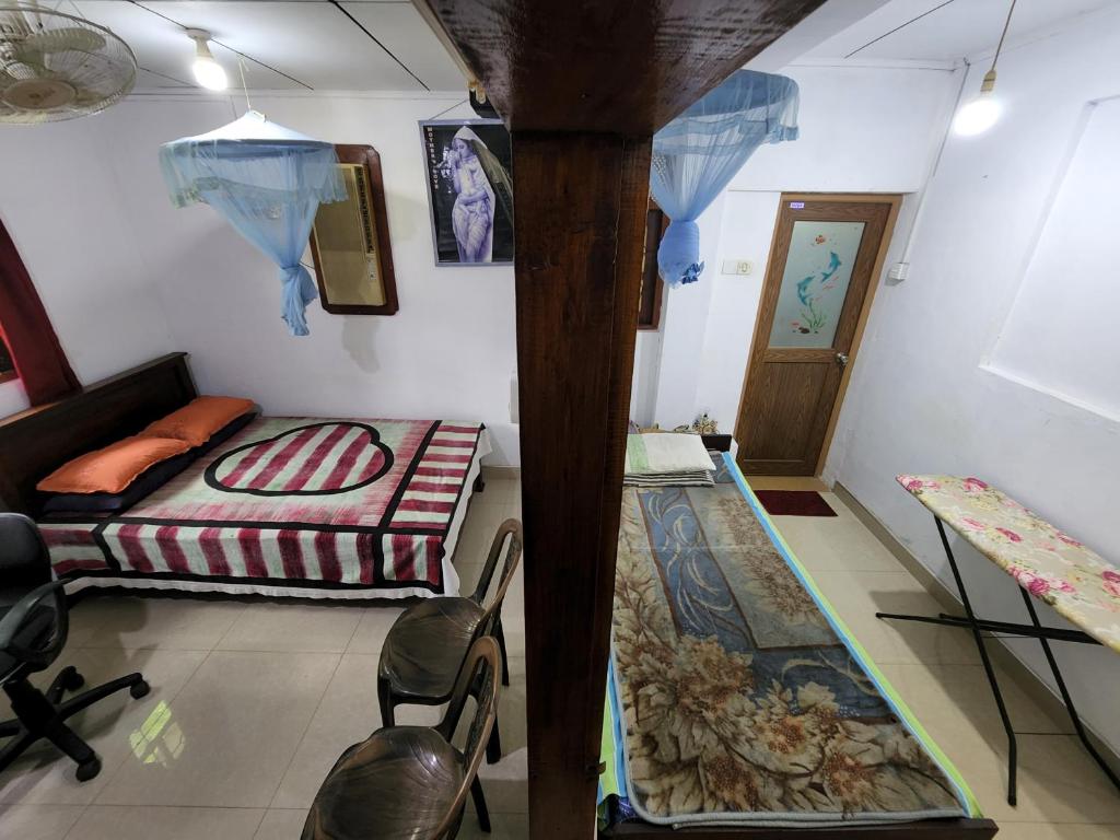 Postel nebo postele na pokoji v ubytování 152-Abhaya Place Homestay