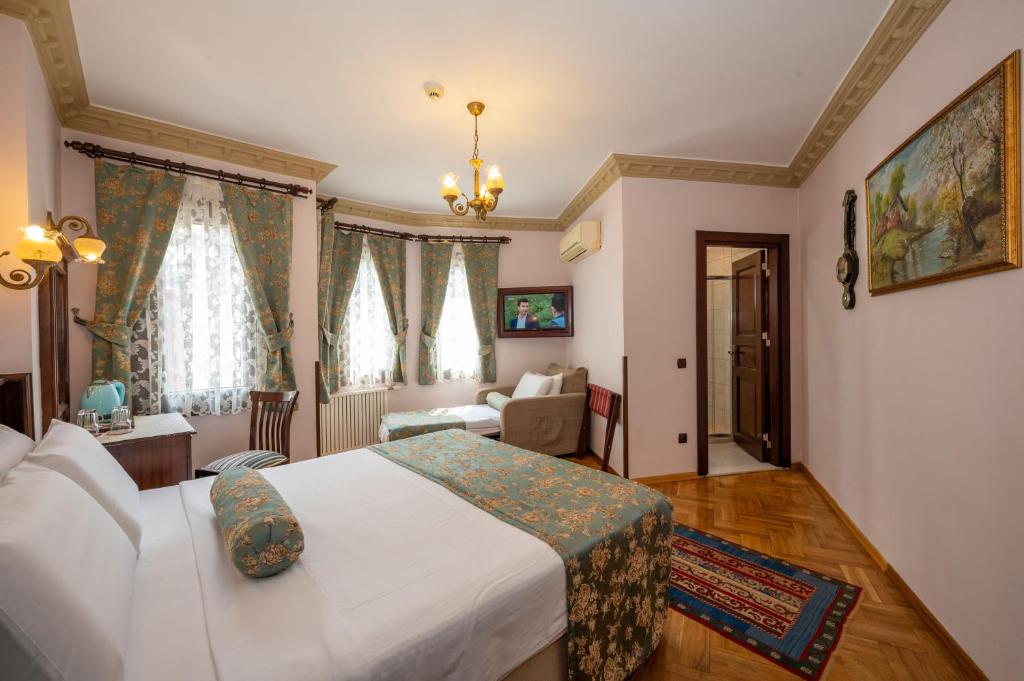 Postel nebo postele na pokoji v ubytování Osmanhan Hotel