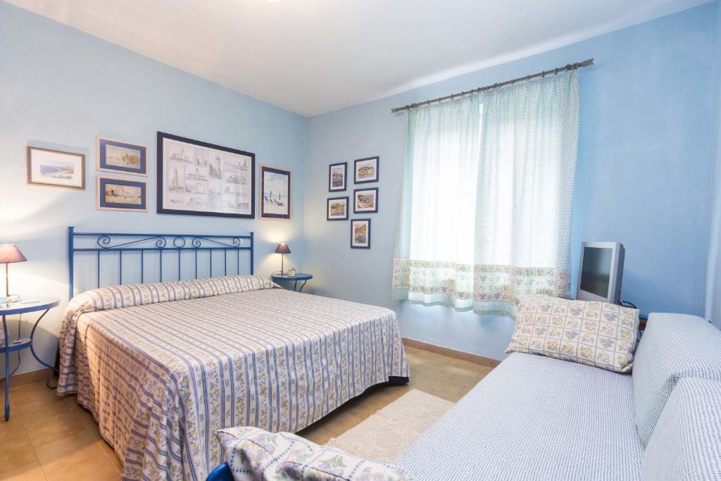 Postel nebo postele na pokoji v ubytování Villa Monserrato - Goelba