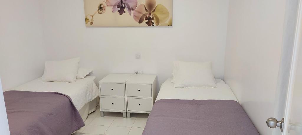 Posteľ alebo postele v izbe v ubytovaní Apartamento junto a la playa. Corralejo