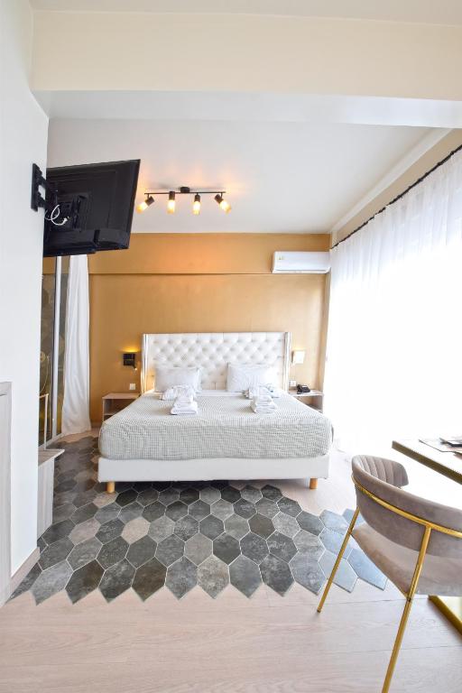Łóżko lub łóżka w pokoju w obiekcie John's Hotel