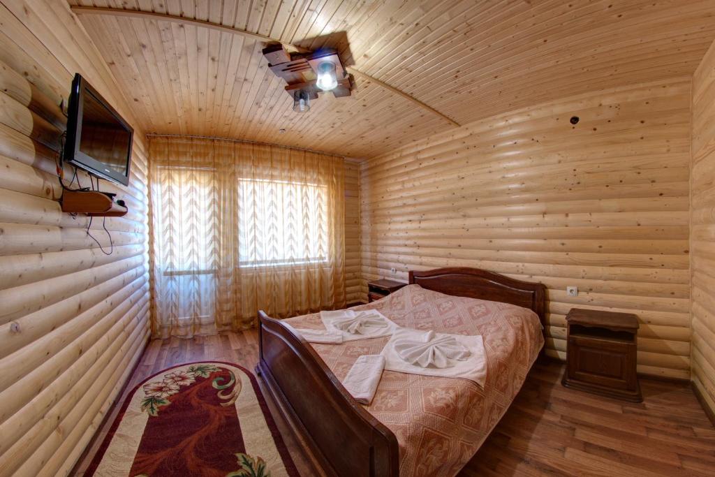 Postel nebo postele na pokoji v ubytování Villa Vlad & Spa