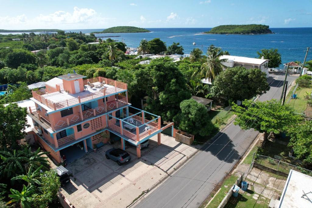 an aerial view of a house with the ocean in the background at Esperanza Inn Guesthouse in Vieques