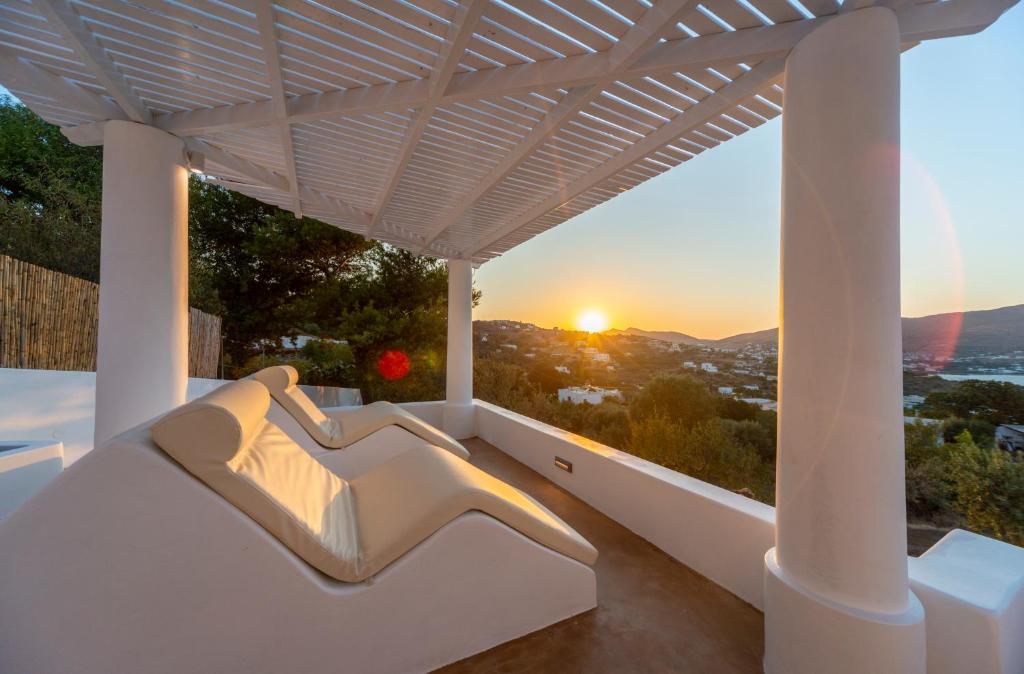 a view of the sunset from the balcony of a house at Hidden Oasis Private Villa in Agia Marina