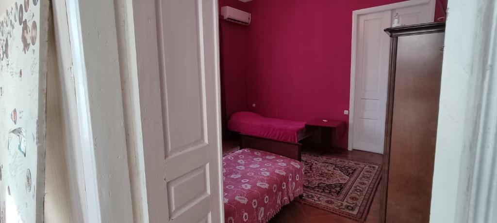 Postel nebo postele na pokoji v ubytování Guest House Tall Rooms