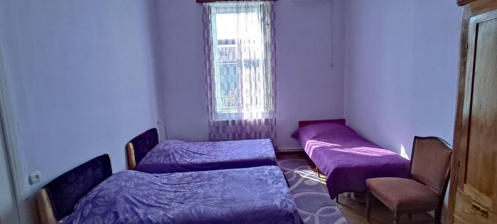 Postel nebo postele na pokoji v ubytování Guest House Tall Rooms