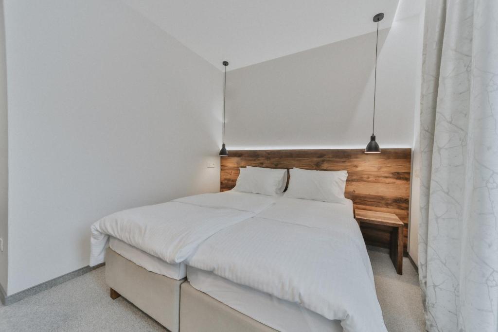 Postel nebo postele na pokoji v ubytování Hotel Vladimir