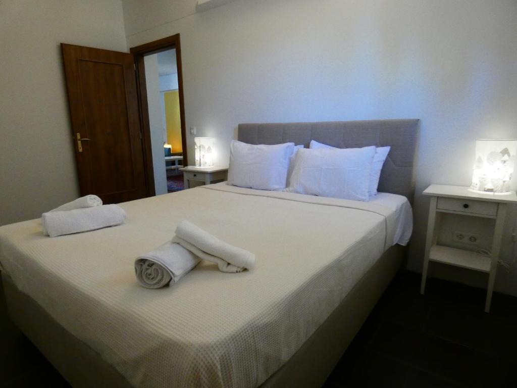 Posteľ alebo postele v izbe v ubytovaní Elysion point Apartment