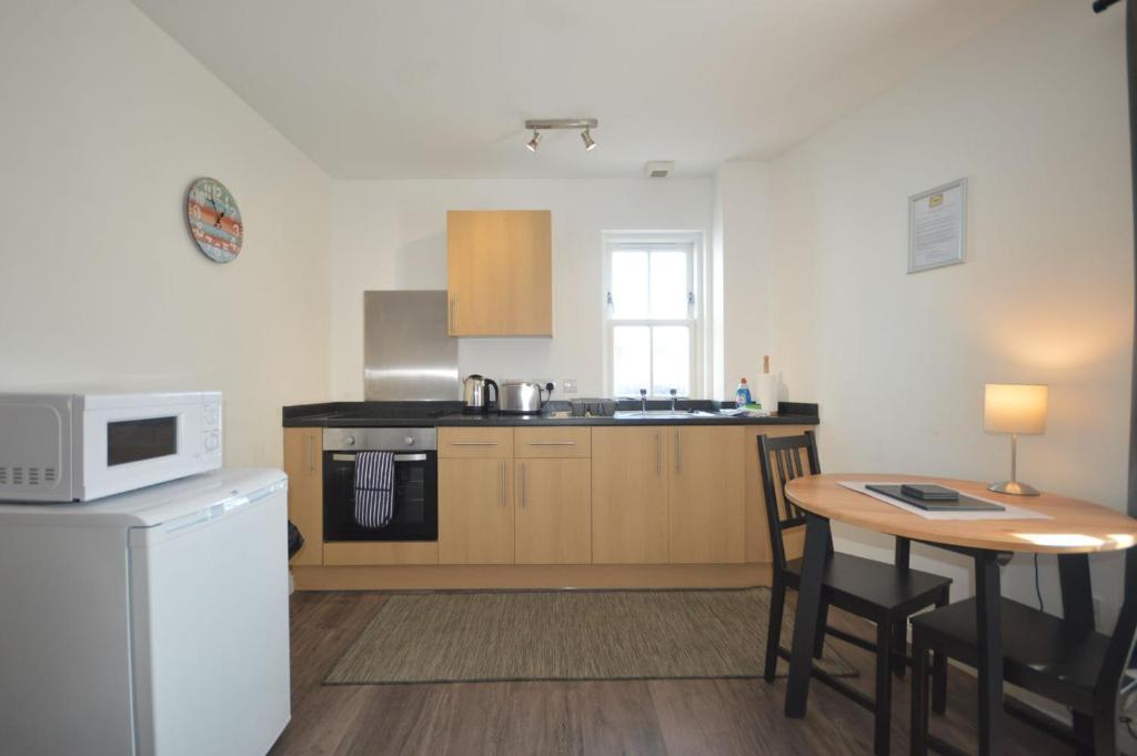 Kuchyň nebo kuchyňský kout v ubytování Otter Apartment