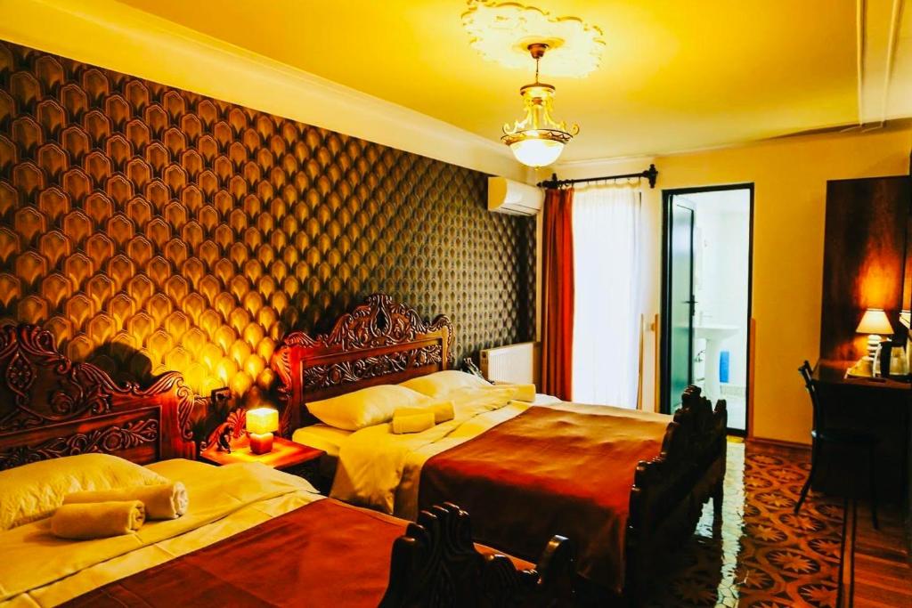 Postel nebo postele na pokoji v ubytování Hotel History