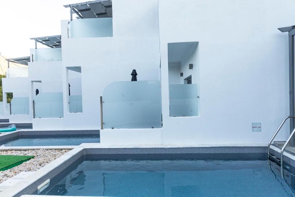 The swimming pool at or close to SKYROS BLUE SUITES
