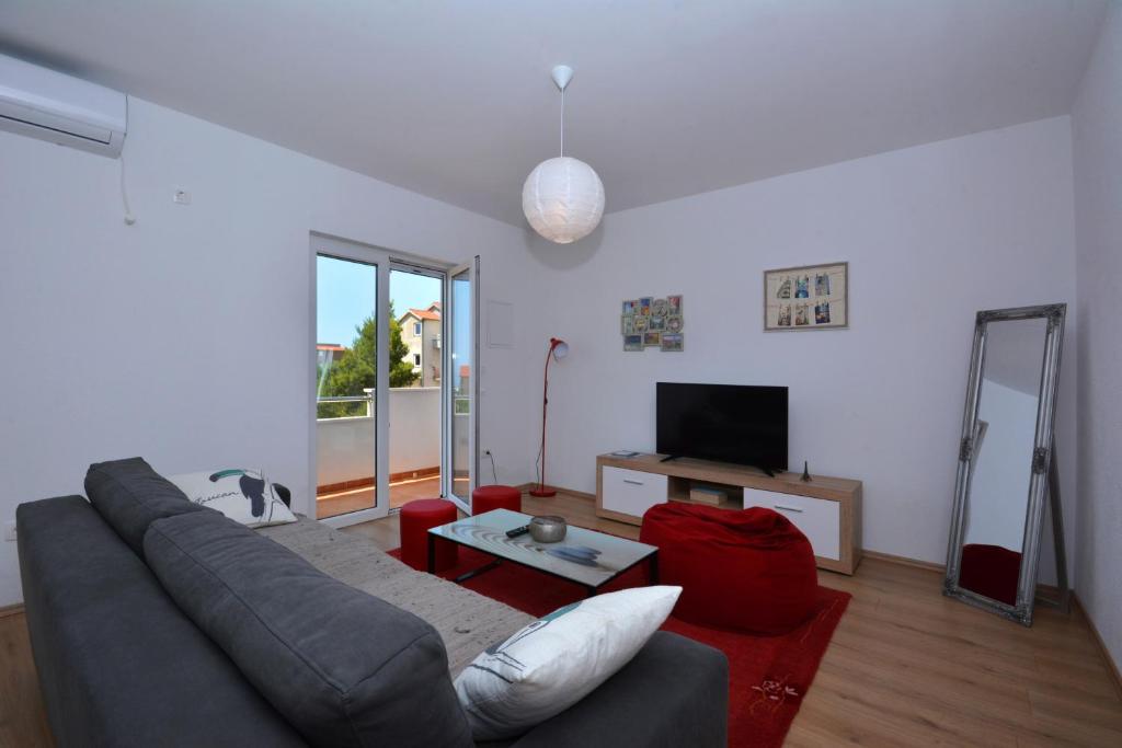 Televízia a/alebo spoločenská miestnosť v ubytovaní Apartment Wild Rose