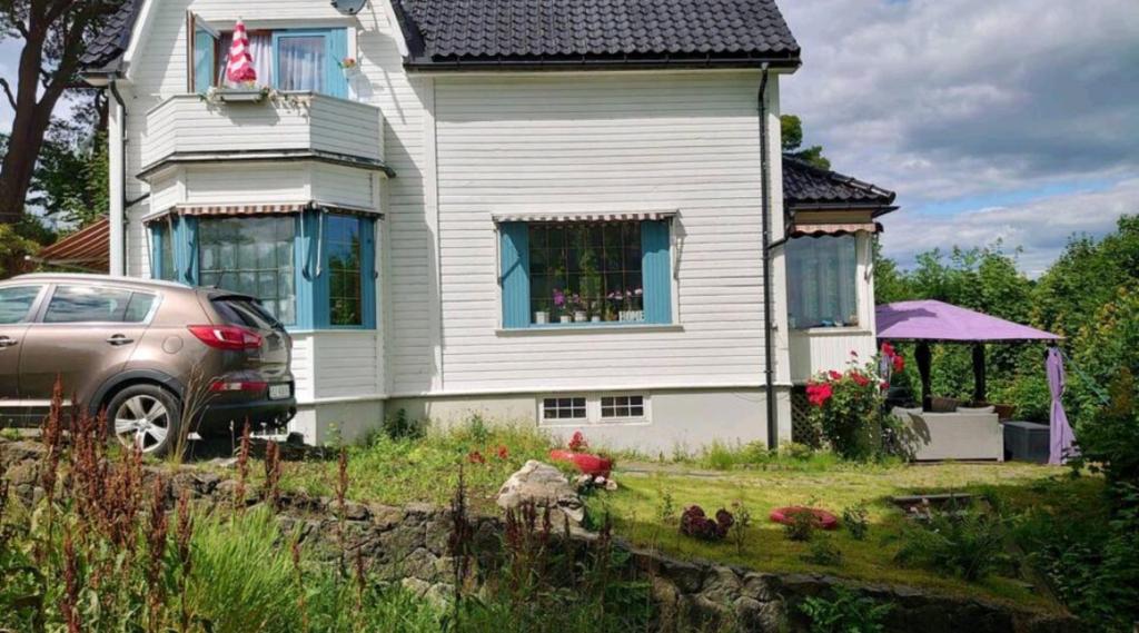a house with a car parked in front of it at Nahlboms in Sandefjord