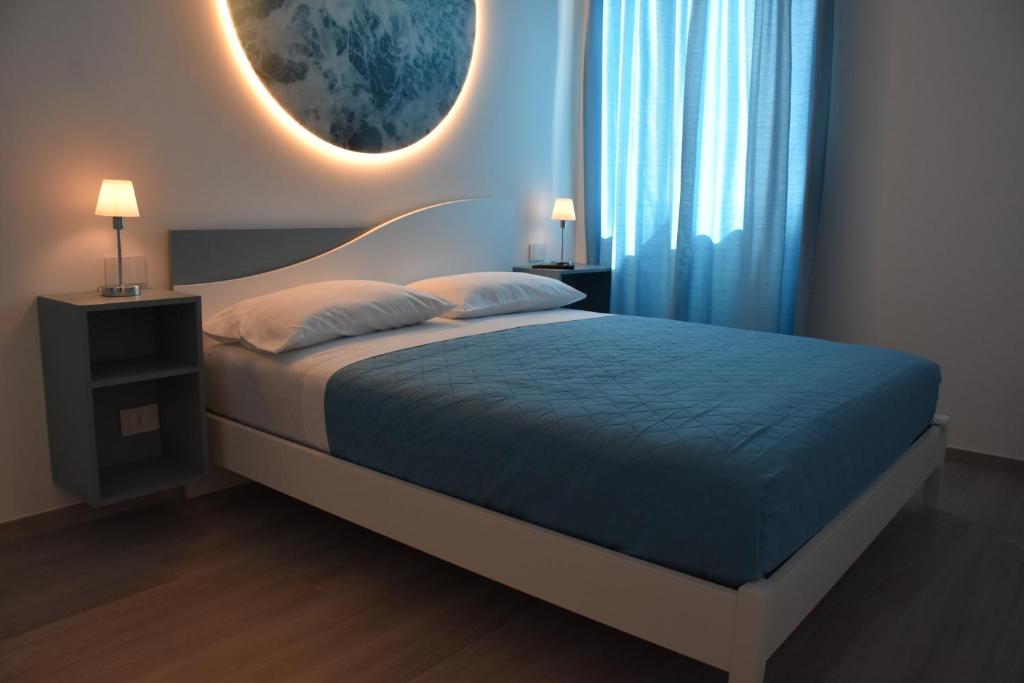 Säng eller sängar i ett rum på Appartamento La Rosa Dei Venti