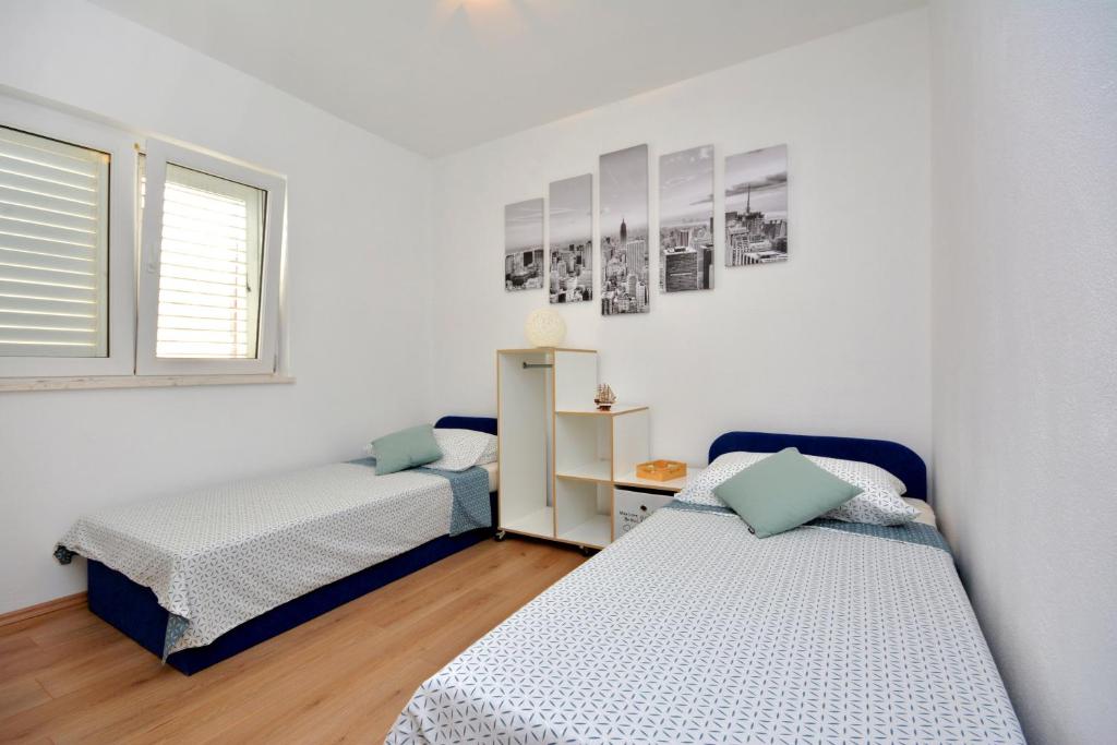 Posteľ alebo postele v izbe v ubytovaní Apartment Wild Rose