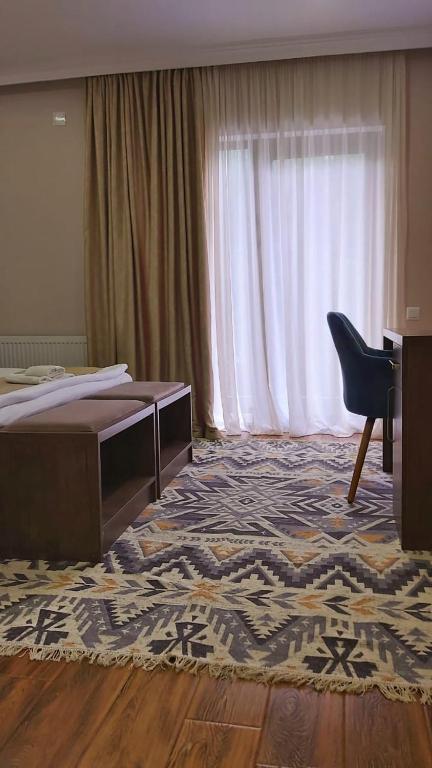 Postel nebo postele na pokoji v ubytování Hotel Mountain Mestia