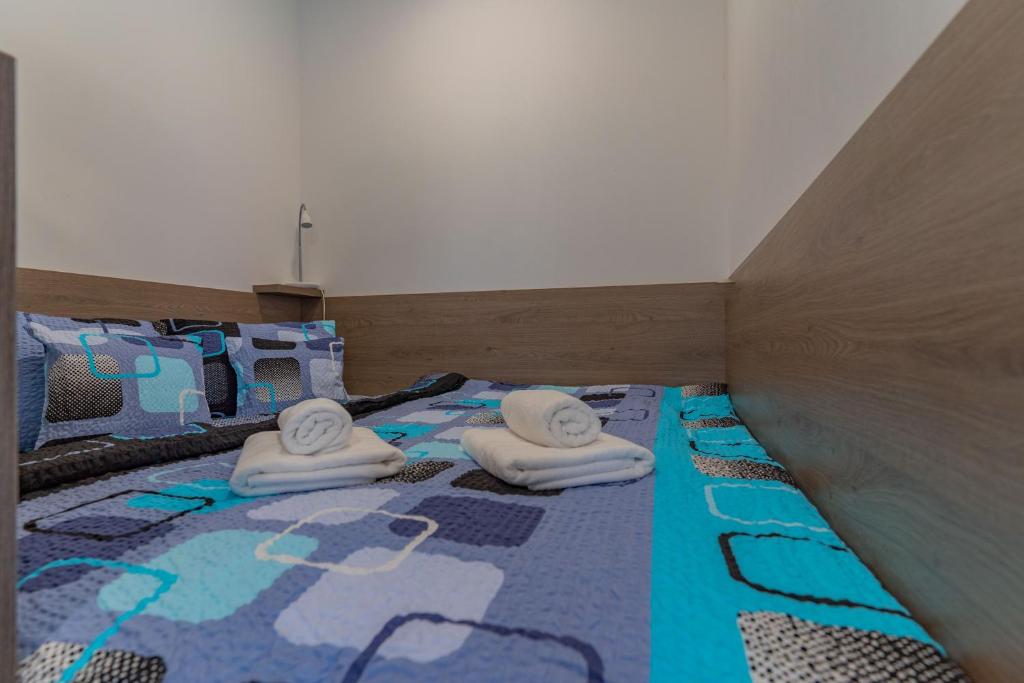 Postel nebo postele na pokoji v ubytování APARTMÁNY POD SJEZDOVKOU