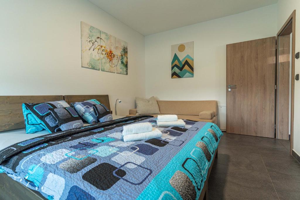 Postel nebo postele na pokoji v ubytování APARTMÁNY POD SJEZDOVKOU