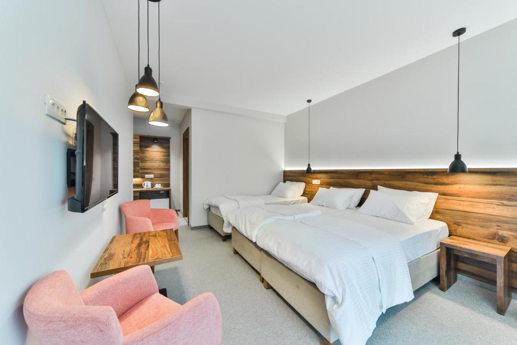 Postel nebo postele na pokoji v ubytování Hotel Vladimir