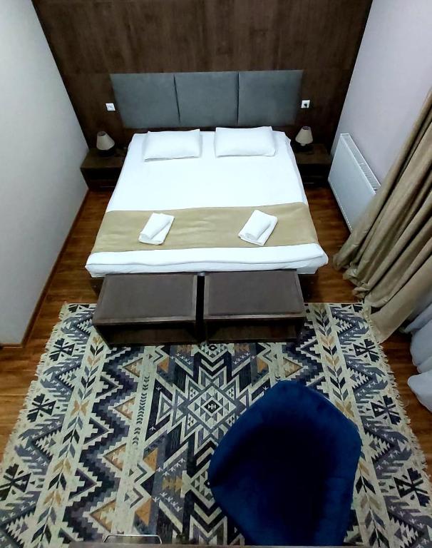 Postel nebo postele na pokoji v ubytování Hotel Mountain Mestia