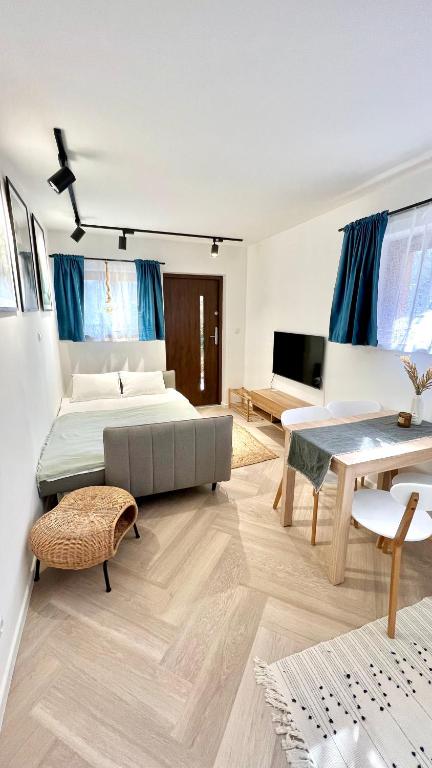 Posteľ alebo postele v izbe v ubytovaní Apartament 21 (1)