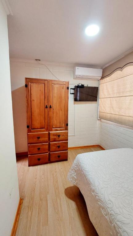 Postel nebo postele na pokoji v ubytování Hostal Aires del Sur Centro de Rancagua