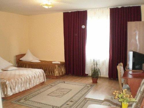 Postel nebo postele na pokoji v ubytování Hotel Delaf