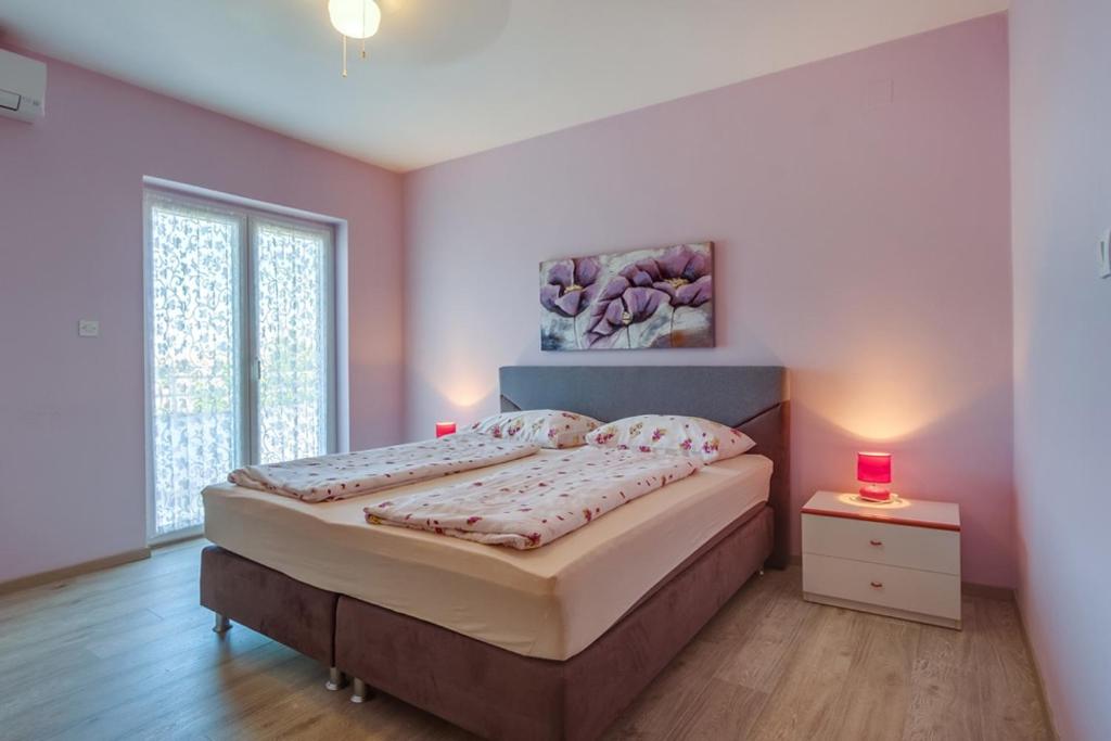 Posteľ alebo postele v izbe v ubytovaní Rooms with a parking space Mali Losinj (Losinj) - 3445