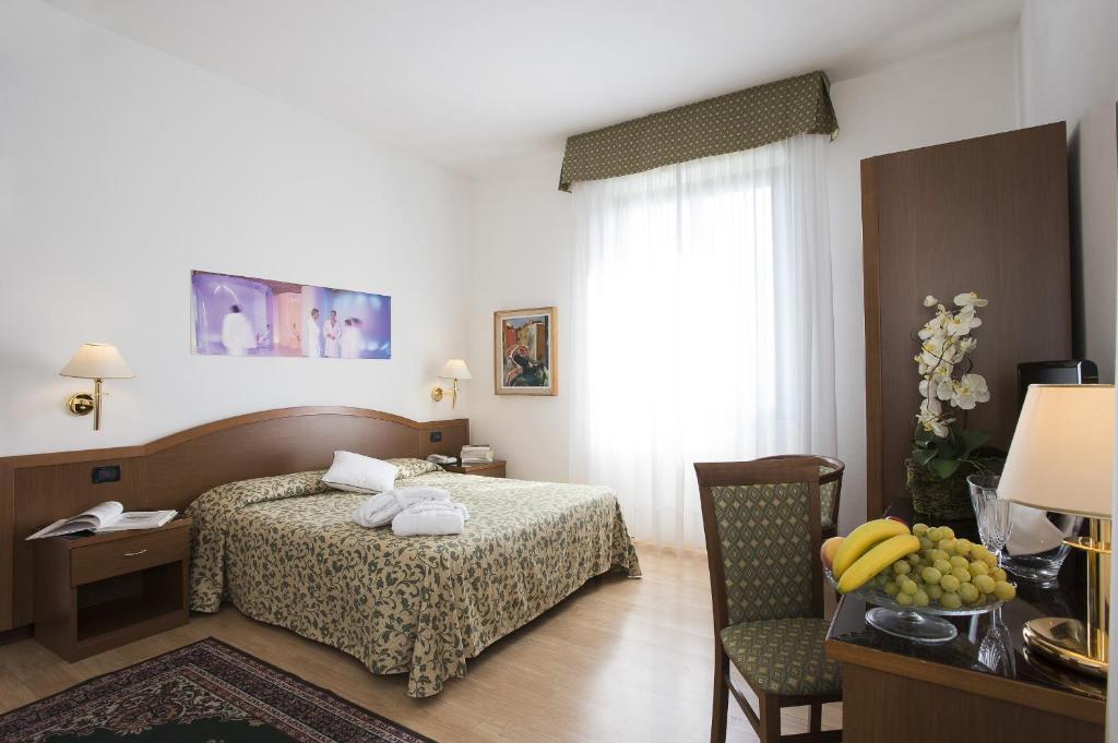 Кровать или кровати в номере Hotel Angiolino