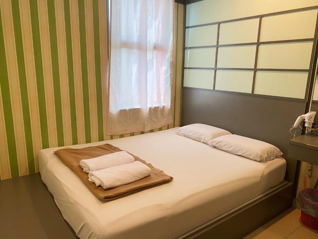 Postel nebo postele na pokoji v ubytování Best Hotel