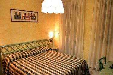 Postel nebo postele na pokoji v ubytování Hotel Blue Rose's