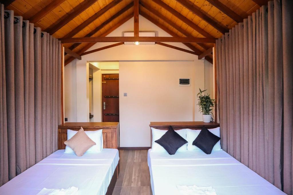 Postel nebo postele na pokoji v ubytování Misty Villas