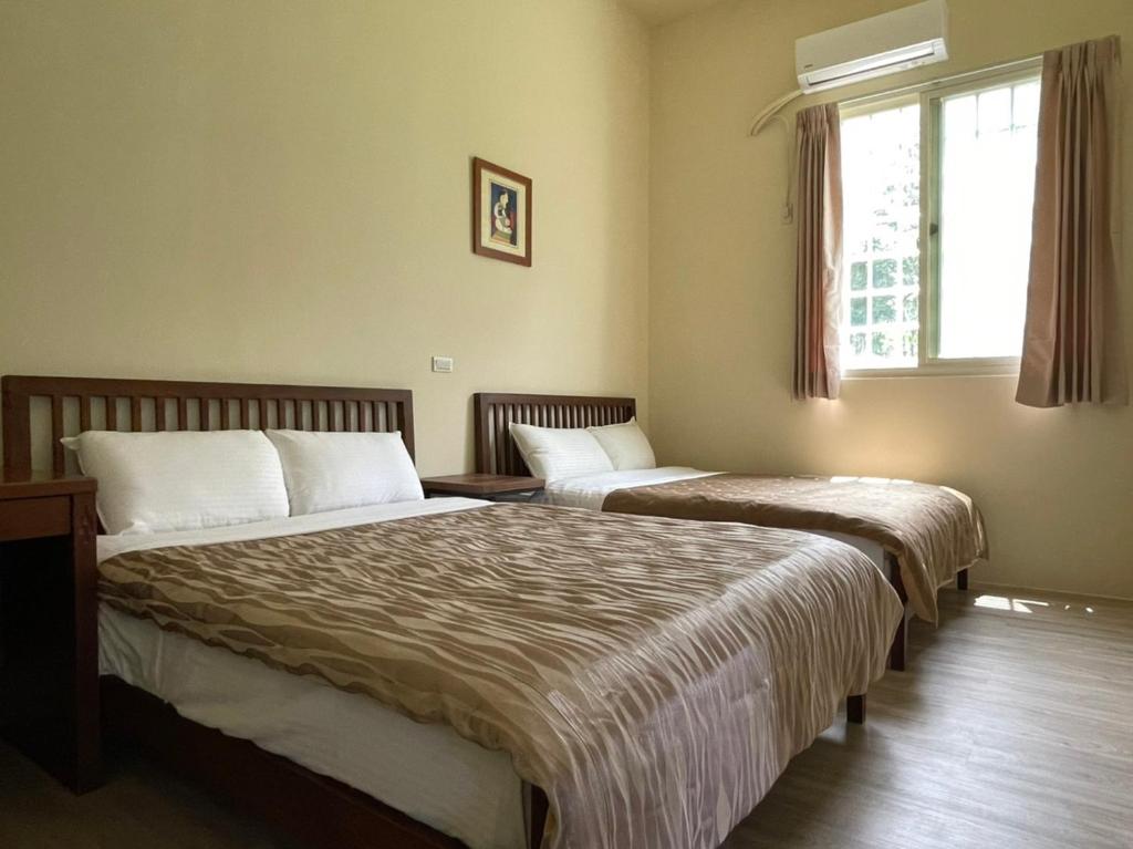Postel nebo postele na pokoji v ubytování Taomi 5211 B&B