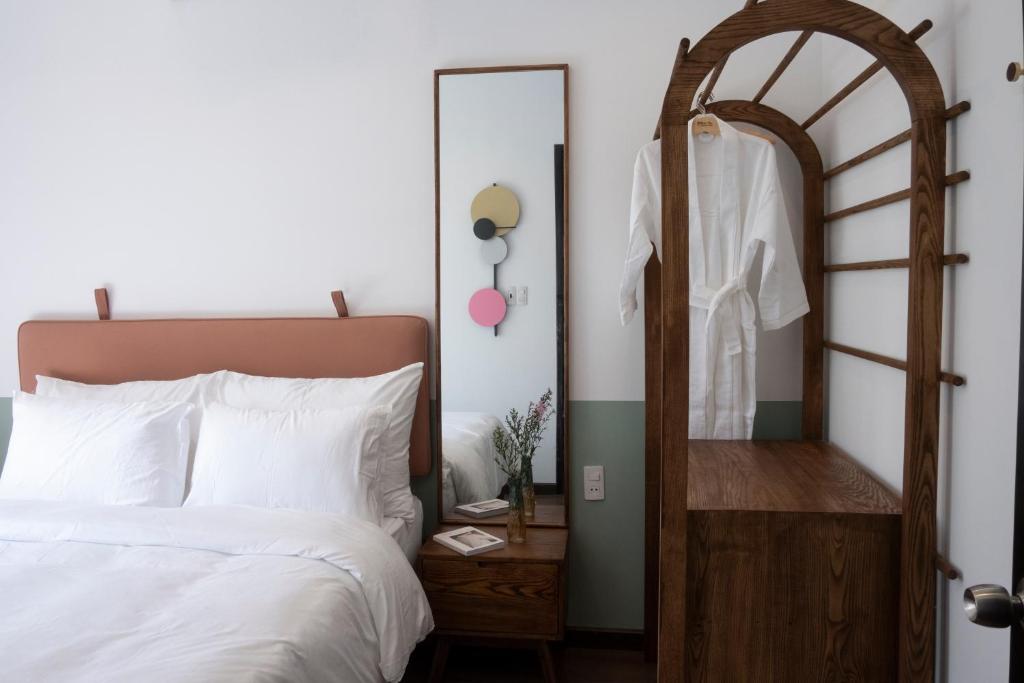 Giường trong phòng chung tại Quang Vinh Apartment and Hotel Hoi An