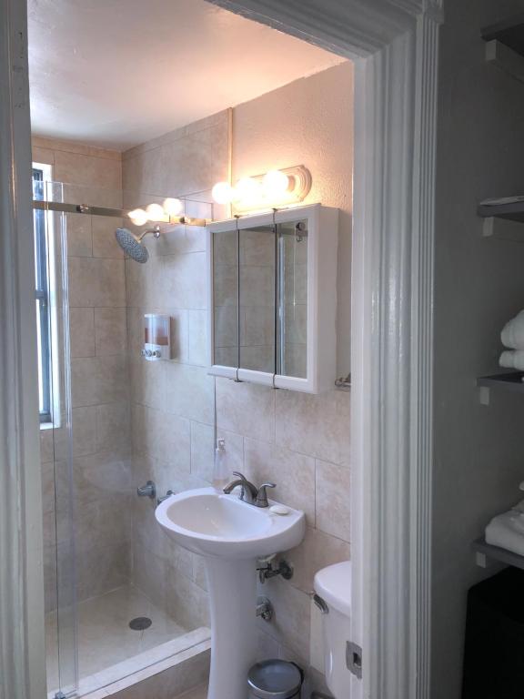 a bathroom with a sink and a shower at Condo 103 in Miami Beach