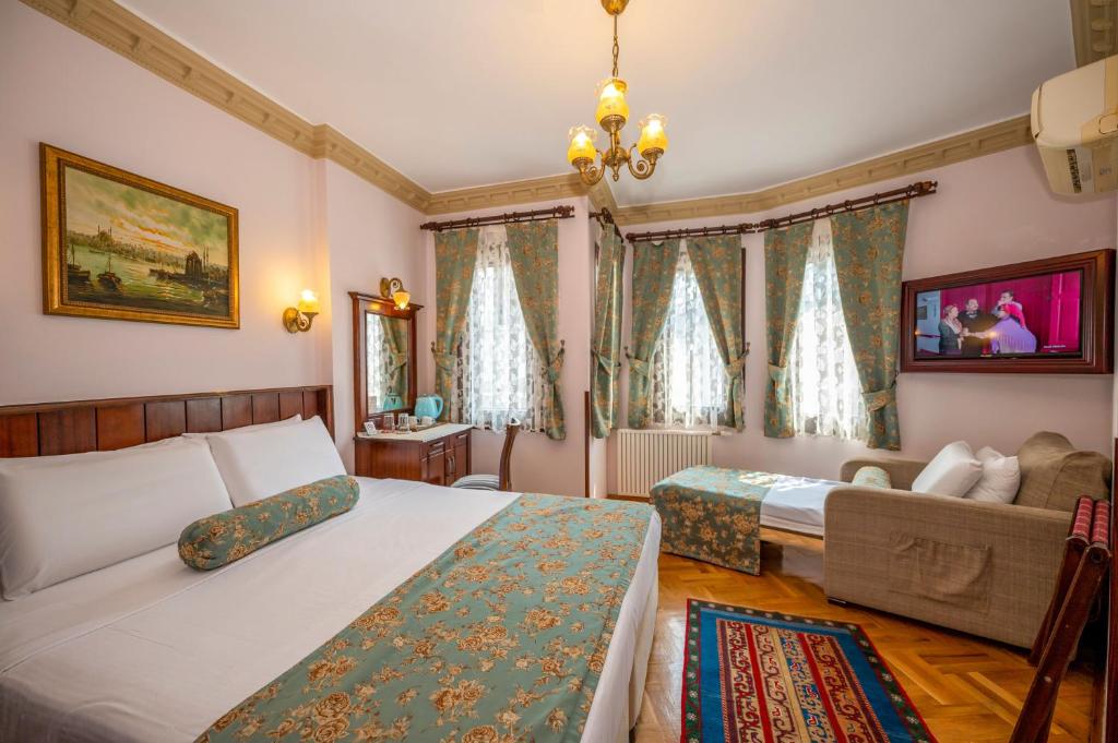 Postel nebo postele na pokoji v ubytování Osmanhan Hotel