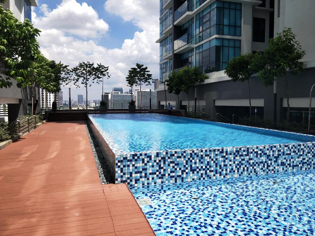 a swimming pool on the side of a building at Netflix # Sky Suite near Jaya One by Salaam Suites, 2 pax in Petaling Jaya