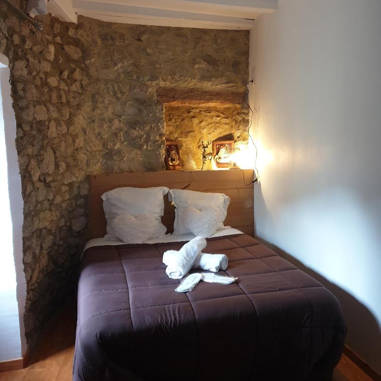 Postel nebo postele na pokoji v ubytování La Petite Chapelle