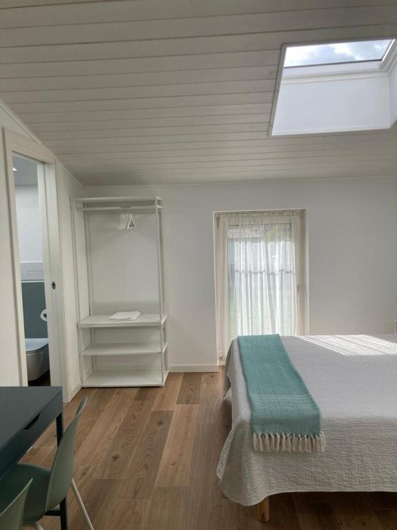 Letto o letti in una camera di BiancoGelso b&b Vegan