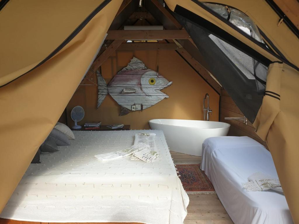 Postel nebo postele na pokoji v ubytování Agriturismo Podere il Fornacino