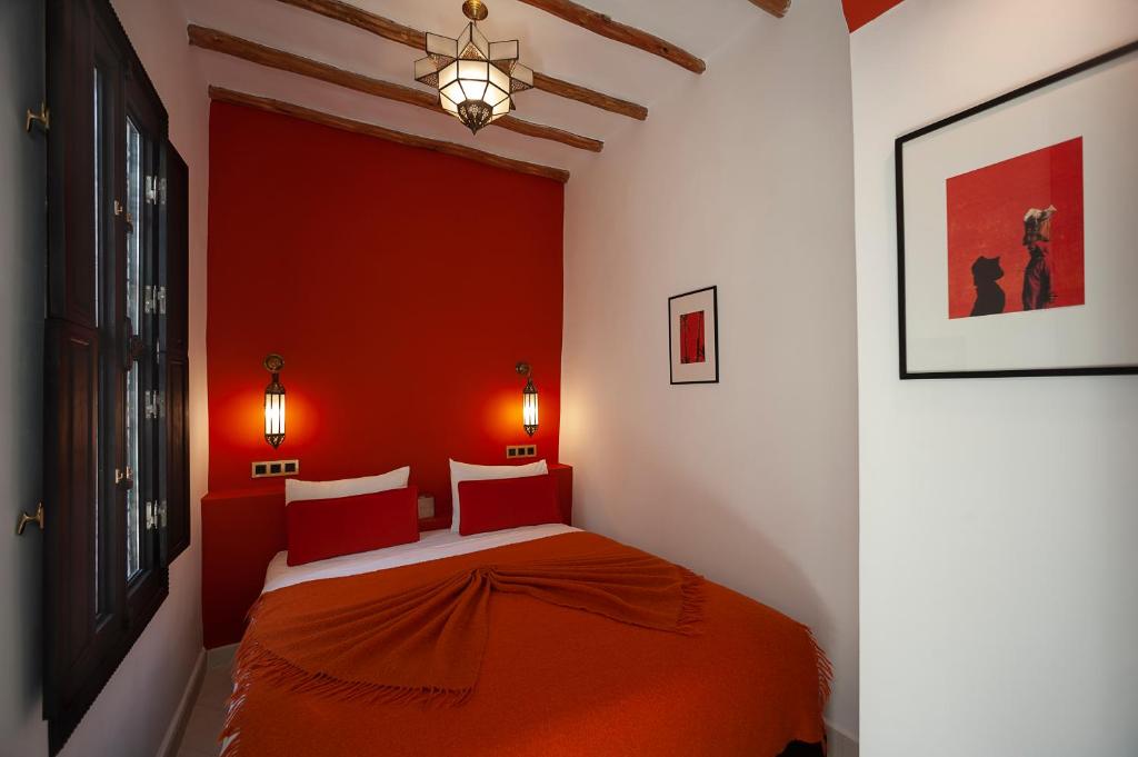 Un pat sau paturi într-o cameră la Riad Mylaya