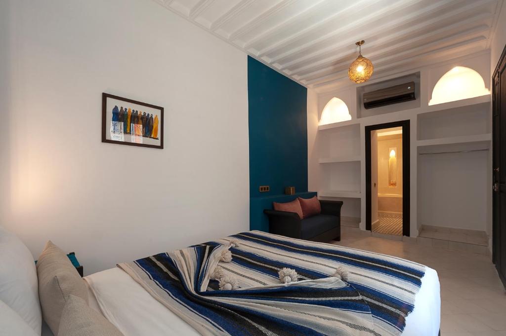 Un pat sau paturi într-o cameră la Riad Mylaya