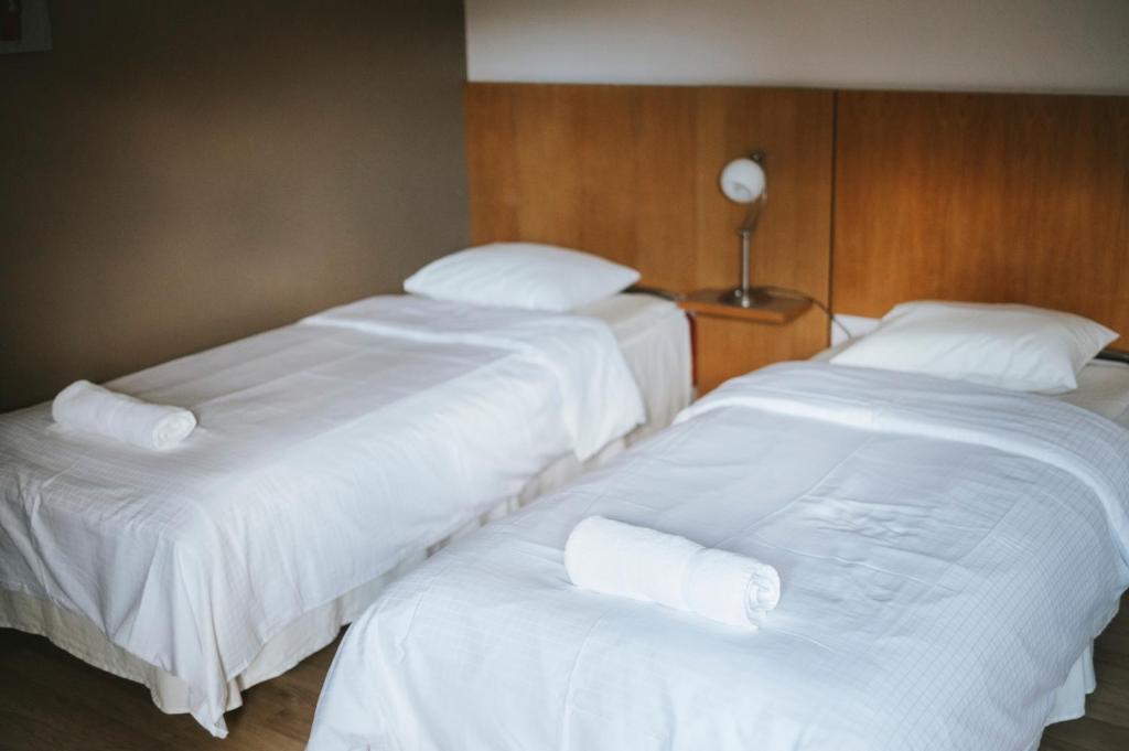 Postel nebo postele na pokoji v ubytování Nadden Hotell & Konferens