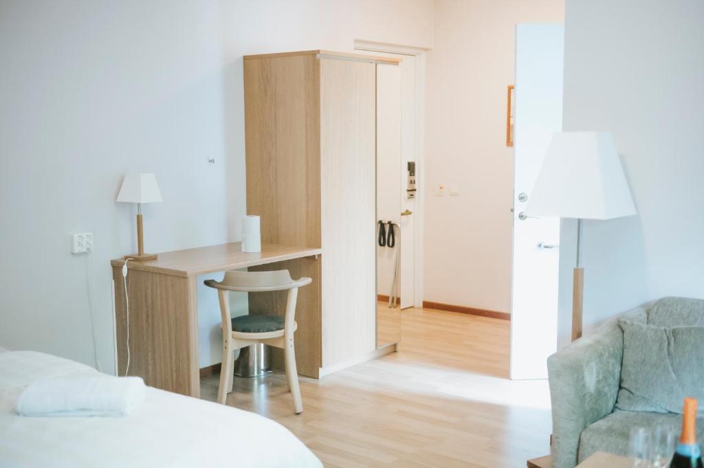 Postel nebo postele na pokoji v ubytování Nadden Hotell & Konferens