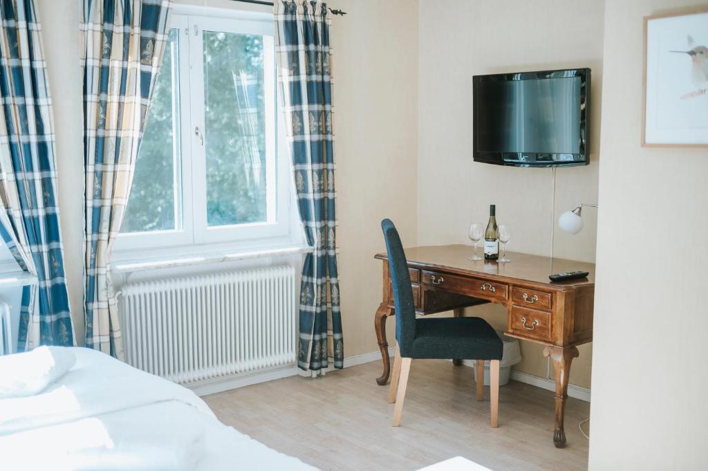 TV a/nebo společenská místnost v ubytování Nadden Hotell & Konferens