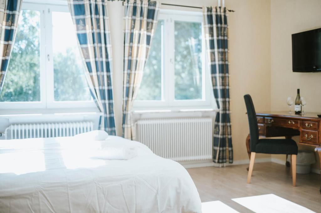 Postel nebo postele na pokoji v ubytování Nadden Hotell & Konferens