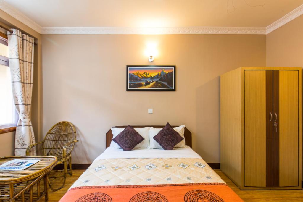 Postel nebo postele na pokoji v ubytování Hotel Acme Inn